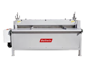 Machine de découpe longitudinale pour courroies en caoutchouc robustes